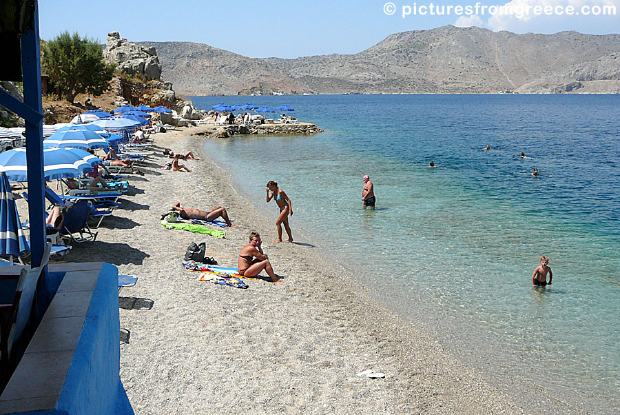 The best beach near the port in Symi is Nos beach. Here is a taverna.