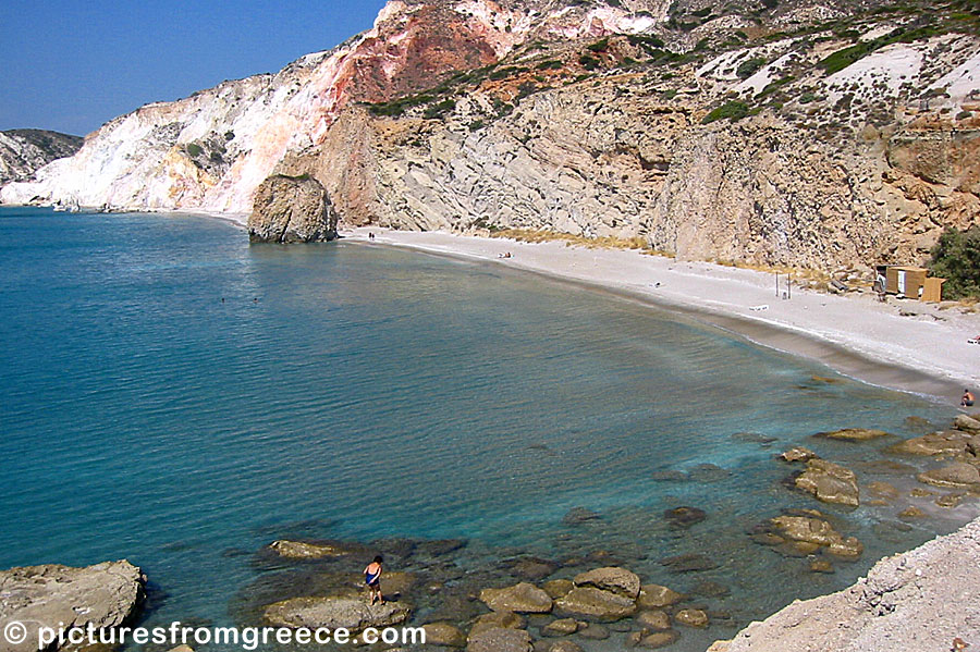 Firiplaka beach in Milos is surrounded by beautiful ochre coloured cliffs.
