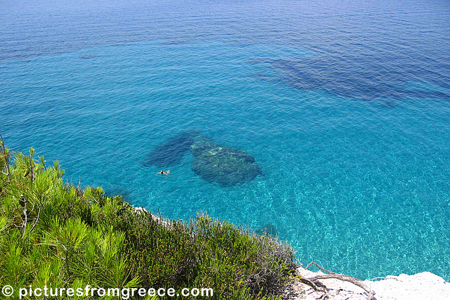 Swim in the blue water at Hovolos beach in Skopelos